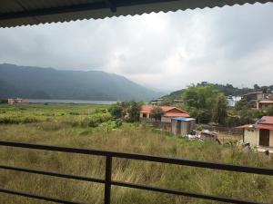 a view of a village with a mountain in the background at hotel lakema in Pokhara