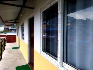 a window on the side of a building at hotel lakema in Pokhara +6 photos