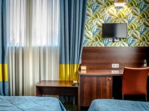 Postel nebo postele na pokoji v ubytování Road Star Hotel + 37 fotografií