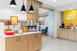 a lobby of a waiting room with a counter at Hampton Inn Carrollton in Carrollton
