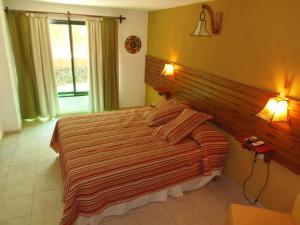 Postel nebo postele na pokoji v ubytování Hotel Complejo Najul Suites-Solo Adultos