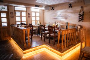 a dining room with a table and chairs at Bed & Breakfast LakeBled House in Bled