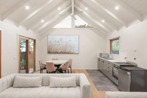 a living room with a couch and a table at Seaview Escape in Ventnor
