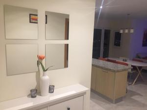 a room with a vase with a flower in it at Résidence Saradon La Zenia Boulevard in Los Dolses +43 photos