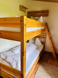 a couple of bunk beds in a room at Ferienwohnungen Hänsel und Gretel - zentral, gemütlich, nah am See in Schliersee