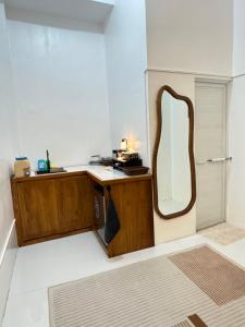 a dressing room with a mirror on a desk at Spacious Bunk Bed & Dedicated Workspace in Baler