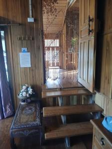 an inside view of a room with a door and a table at Blue Sky Monjam in Chiang Mai +30 photos