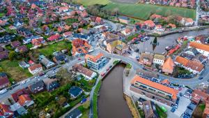 an aerial view of a town next to a river at Nr 301 - Apartmenthaus "Harleblick" in Carolinensiel