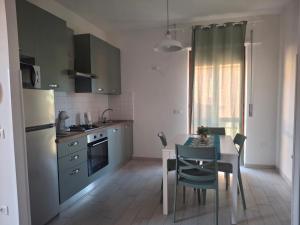 a kitchen with a table and a dining room at Al' Rrigo in Bolsena