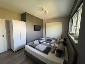a bedroom with two beds and a window at Stilapartment Loft #Whirlpool saisonal in Wernigerode
