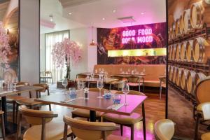 a restaurant with tables and chairs and a sign that reads good food and wine at DoubleTree by Hilton Dartford Bridge in Dartford +66 photos