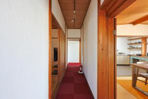 a hallway of a house with a red floor at Authentic Local Experience House in Nara +23 photos