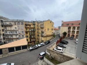a view of a city with cars parked on a street at Appartement climatisé centre-Ville in Bastia