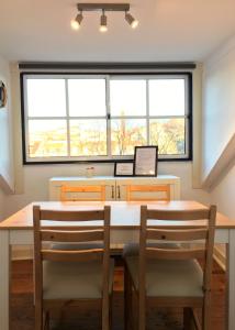 a dining room with a table and two chairs at Casa de Cima in Lisbon