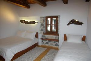 Postel nebo postele na pokoji v ubytování Sabouko Guest House