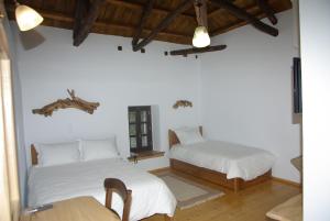 Postel nebo postele na pokoji v ubytování Sabouko Guest House