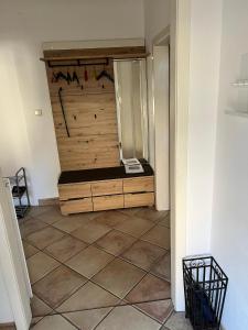 a room with a large wooden closet with a tiled floor at Stadthaus mit traditionellem Flair in Wels