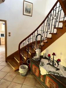 a room with a staircase with a bike on a chest at Stadthaus mit traditionellem Flair in Wels +24 photos