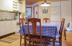 a kitchen and dining room with a table and chairs at Stunning Home In Eksjö With Kitchen in Eksjö