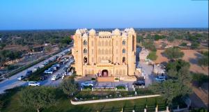 an aerial view of a large building with a parking lot at Abhushan Mahal in Nīmri