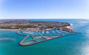 an aerial view of a small island in the water at Waters Edge in Urangan