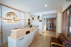 a showroom with a show house sign on the wall at SNOW HOUSE Buriram in Buriram