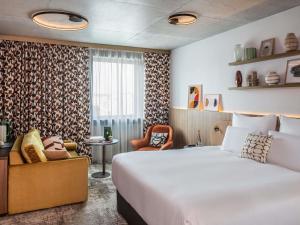 เตียงในห้องที่ Pullman Lyon +74 ภาพ