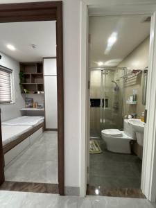 a bathroom with a shower and a toilet and a sink at SQUIRRELHOME District8 in Ho Chi Minh City +35 photos