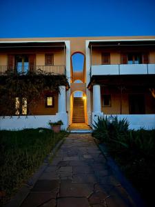 a building with a stairway leading to a house at Casa Rina in Piano Conte