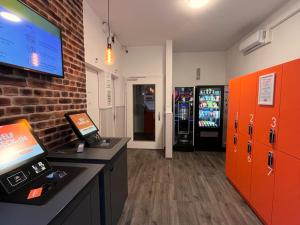 an office with a cash register and a cash machine at easyHotel Zürich City Limmatplatz in Zurich