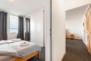 a bedroom with a bed and a mirror at Nordseeblick in Bremerhaven +18 photos