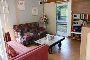 a living room with a couch and a coffee table at Phetmanee Resort in Ko Yao Noi