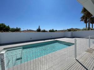 a swimming pool with a fence around it at Casa Miamar II in Campano