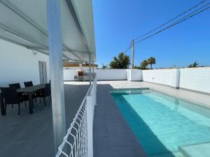 a swimming pool on the roof of a house at Casa Miamar I in Campano