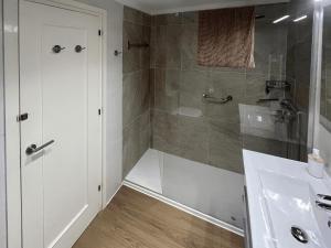 a bathroom with a shower and a sink at Pedro in Roses +29 photos