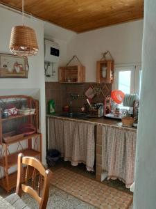 a kitchen with a sink and a counter top at Monolocali Tra Rieti e Terminillo e lago del Salto in Terminillo