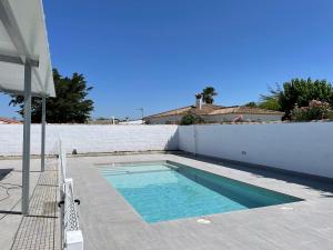 a swimming pool in the backyard of a house at Casa Miamar II in Campano