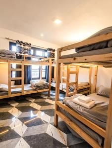 a room with four bunk beds in it at Adventure valley Rajgundha in Kangra
