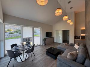 a living room with a couch and a table at Stilapartment Loft #Whirlpool saisonal in Wernigerode