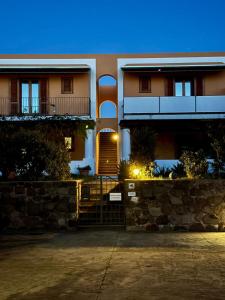a house with a staircase in front of it at CasaMirea in Lipari