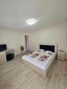 a bedroom with a bed in a white room at 2 Mai - RS in 2 Mai