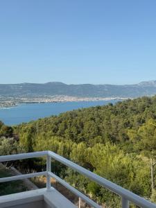 a view of a lake from the balcony of a house at My place Čiovo holiday house in Žedno