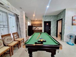 a living room with a pool table in it at Plus 1 2 3 Hua-Hin Private Poolvilla from beach 3km in Hua Hin