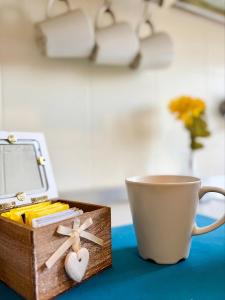 a cup of coffee and a box of matches at ZenZone House in La Spezia +13 photos