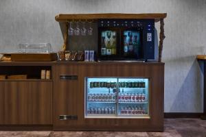 a display case with bottles of alcohol in a bar at Kisara Bettei TOKI in Toba