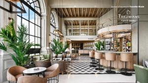 a lobby of a hotel with a bar and chairs at Vincci Ponte de Ferro in Vila Nova de Gaia