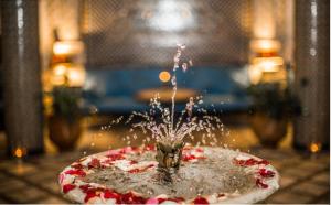 a cake that is in the middle of a fountain at Riad Sara in Fès
