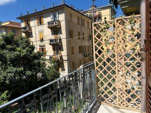 a building with a fence next to a building at Affittacamere Yara 5 Terre in La Spezia