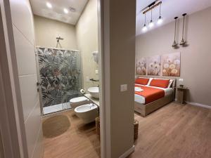 a bedroom with a bed and a bathroom at Affittacamere Yara 5 Terre in La Spezia +62 photos