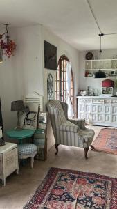 a living room with two chairs and a table at Campagna tutta da vivere in Arquata Scrivia